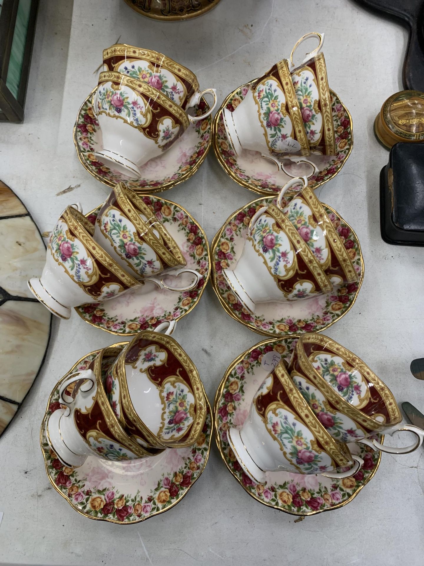 A QUANTITY OF ROYAL ALBERT 'LADY HAMILTON' CUPS AND 'PEACH DAMASK' SAUCERS