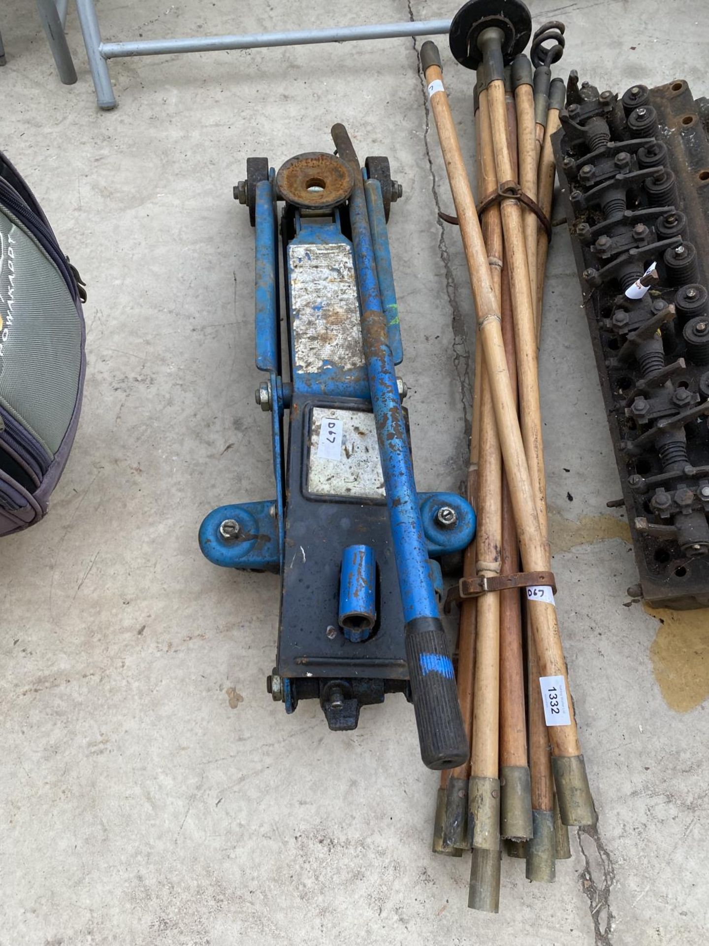 A SET OF VINTAGE DRAINING RODS AND A TROLLEY JACK