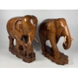 A PAIR OF VINTAGE CARVED WOODEN TRIBAL FAMILY OF ELEPHANT FIGURES, HEIGTH 27CM