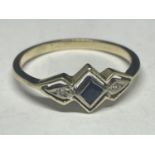 A TESTED TO 14 CARAT GOLD RING WITH A DECO STYLE CENTRE SAPPHIRE AND A DIAMOND EACH SIDE SIZE N