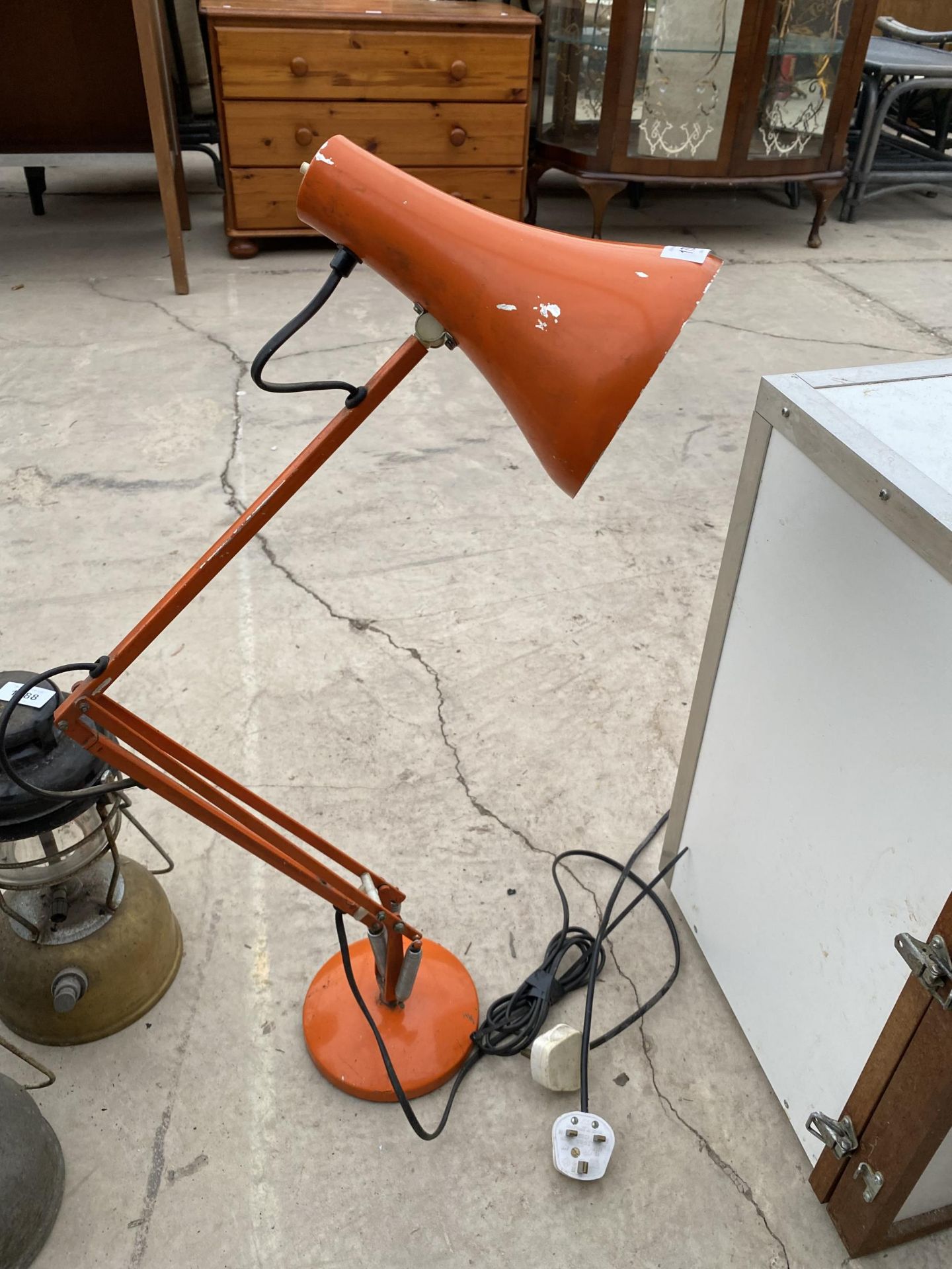 A RETRO ORANGE ANGLE POISE LAMP