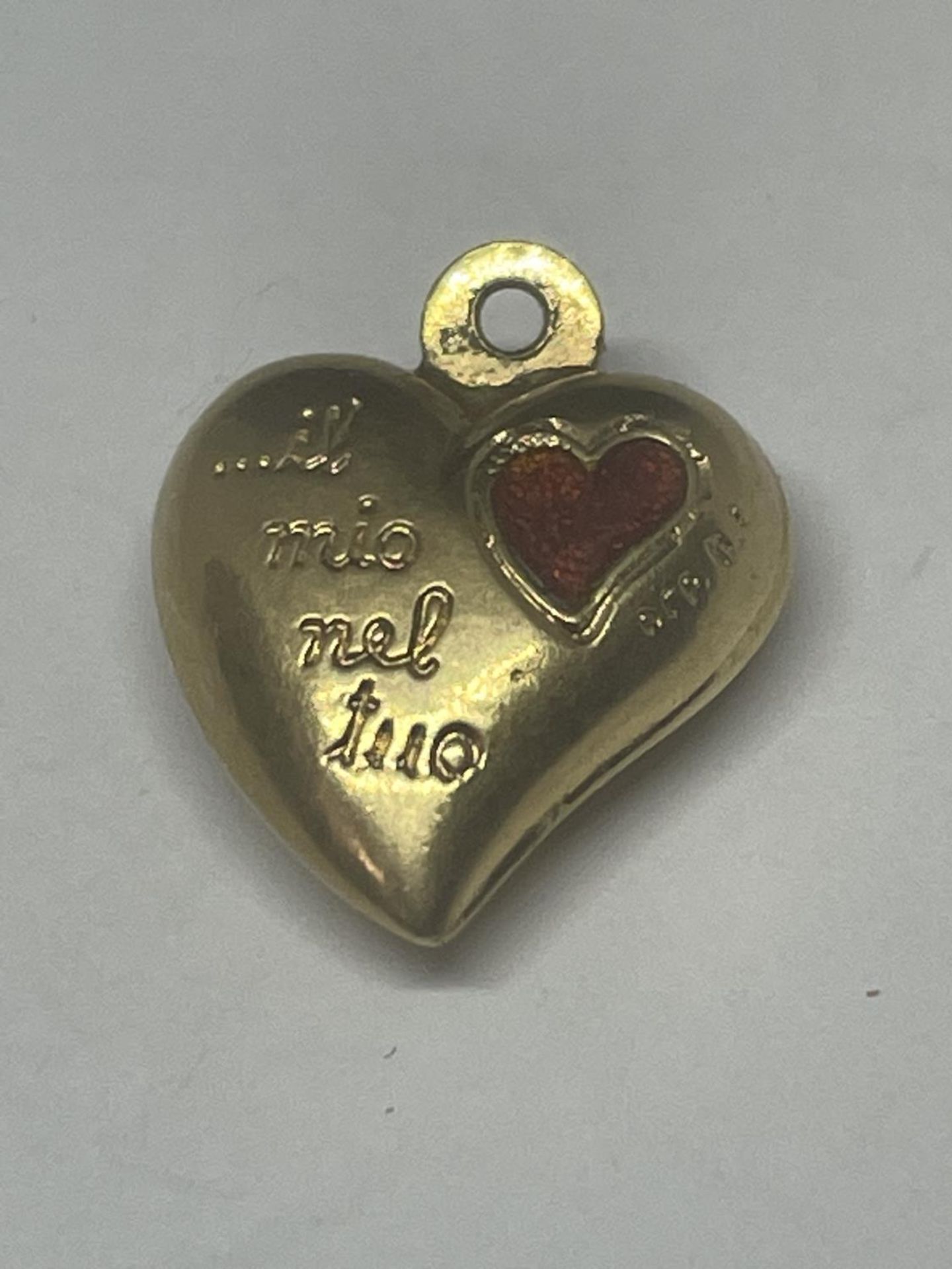 AN 18 CARAT GOLD HEART PENDANT GROSS WEIGHT 1.44 GRAMS