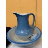 A LARGE WASHBOWL AND JUG IN BLUE MARKED TO THE BASE WITH 'BRITISH ANCHOR'
