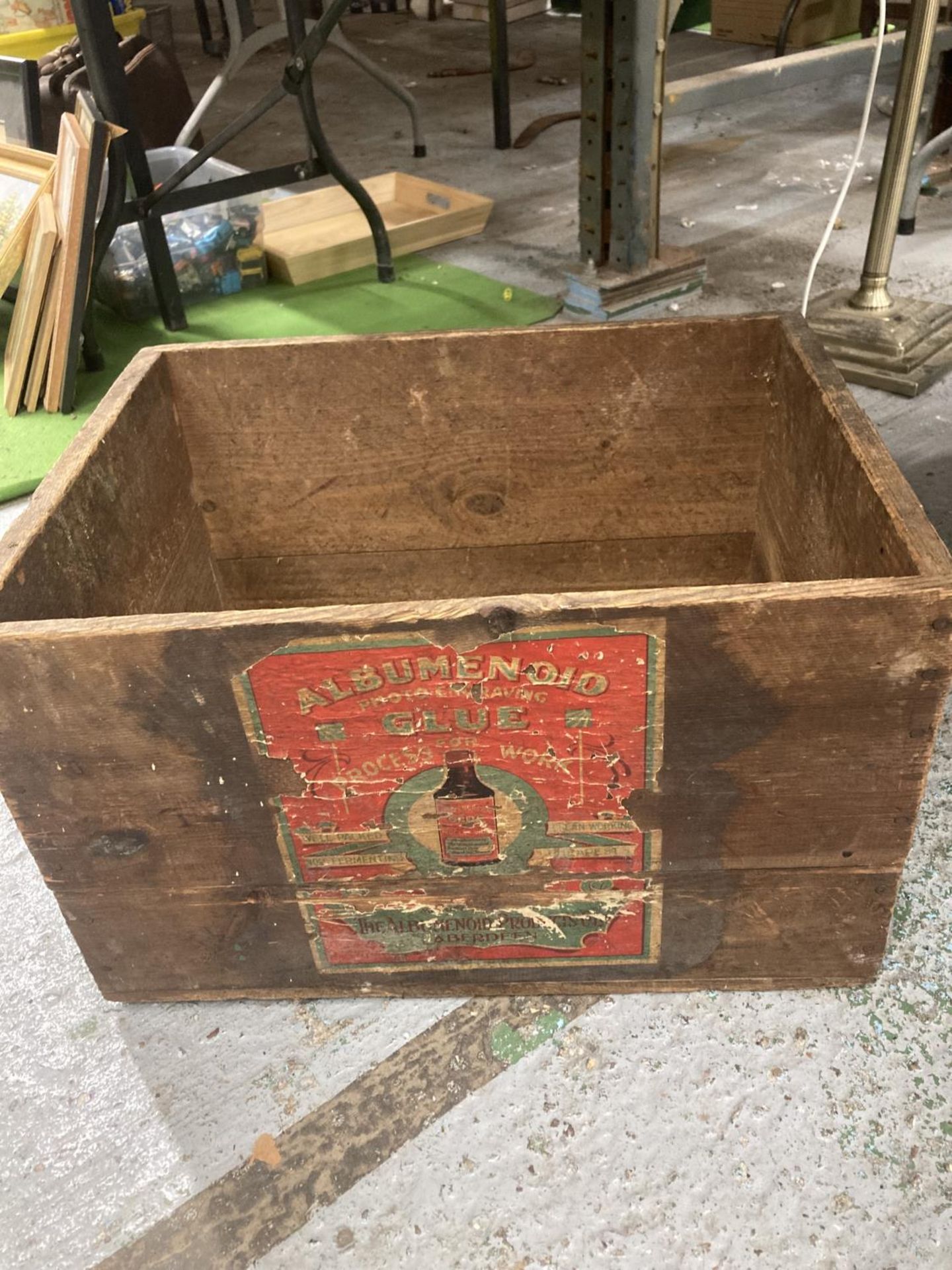 A VINTAGE BOX WITH A PHOTO ENLARGING GLUE LABEL