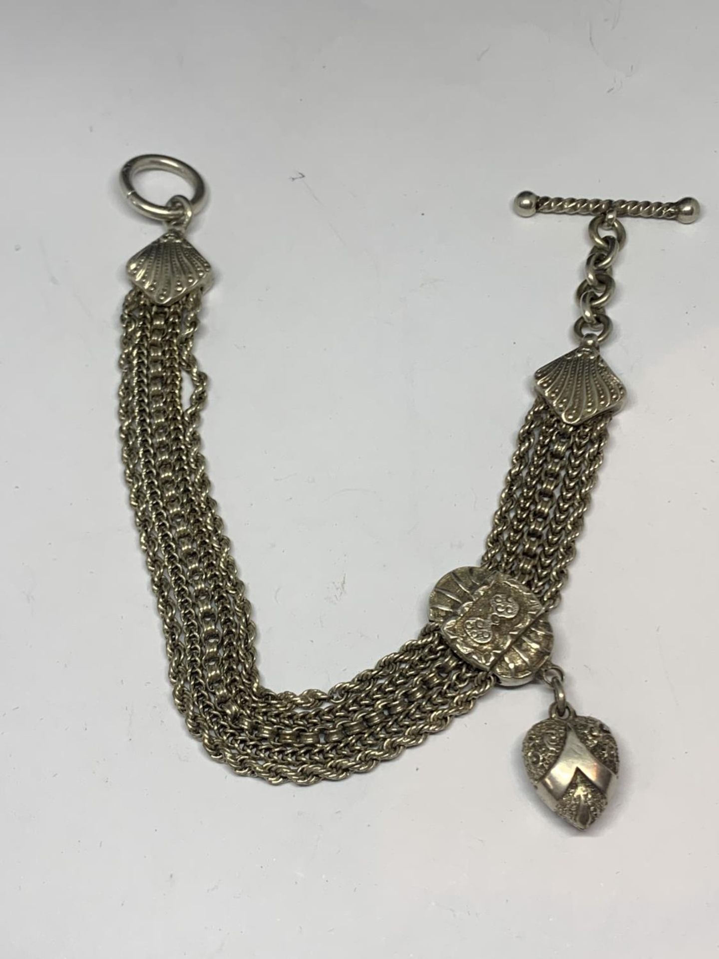 AN ORNATE SILVER HALF ALBERT WATCH CHAIN