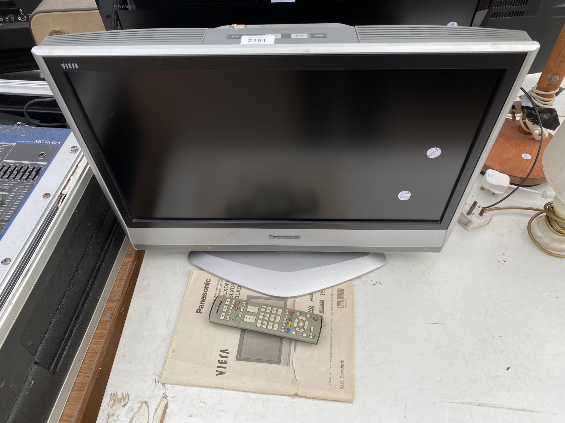 A PANASONIC 23" TELEVISION WITH REMOTE CONTROL