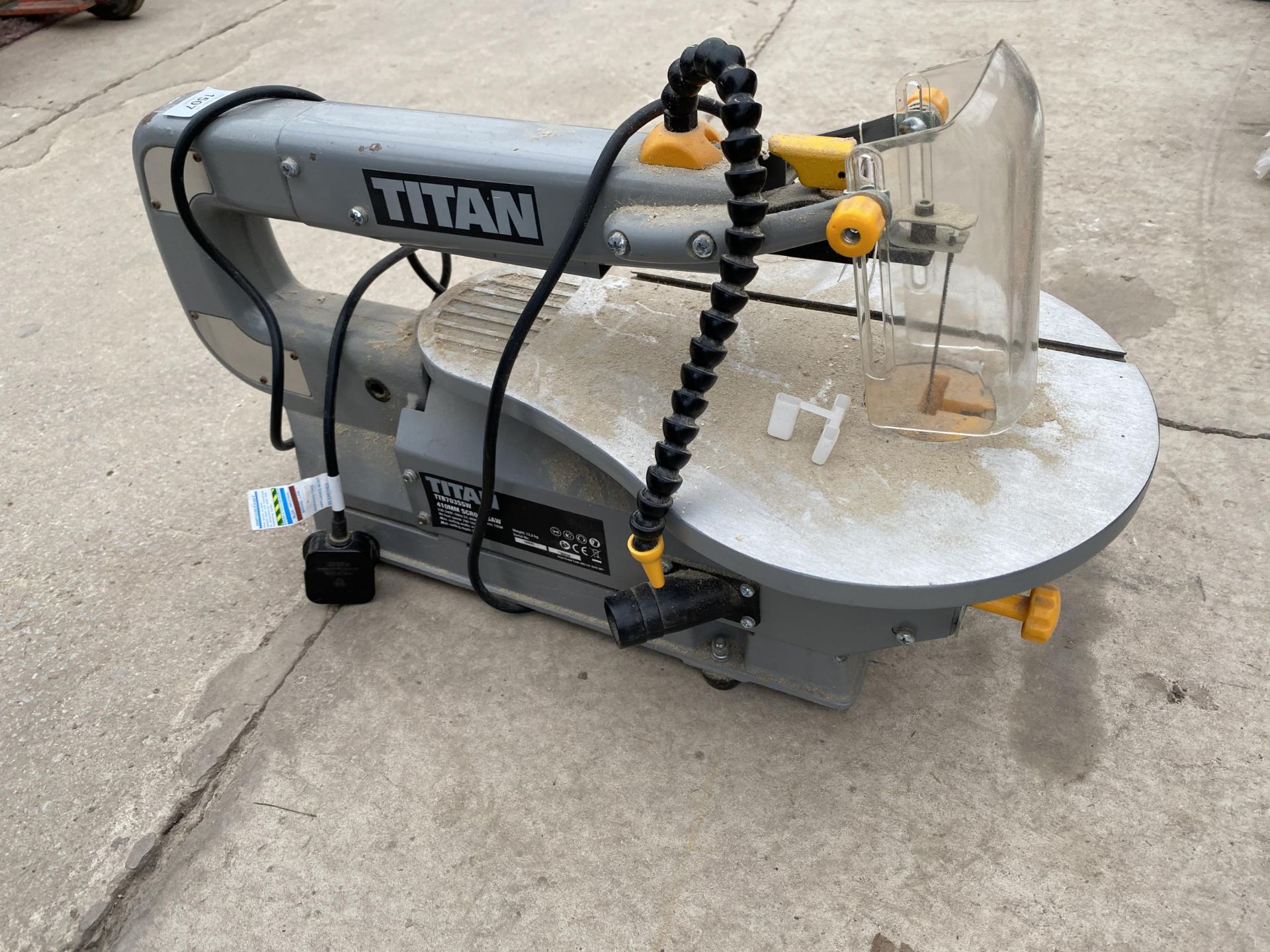 A TITAN TTB703SCW SCROLL SAW BELIEVED IN WORKING ORDER BUT NO WARRANTY