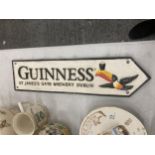 A CAST GUINNESS SIGN 39CM X 10CM