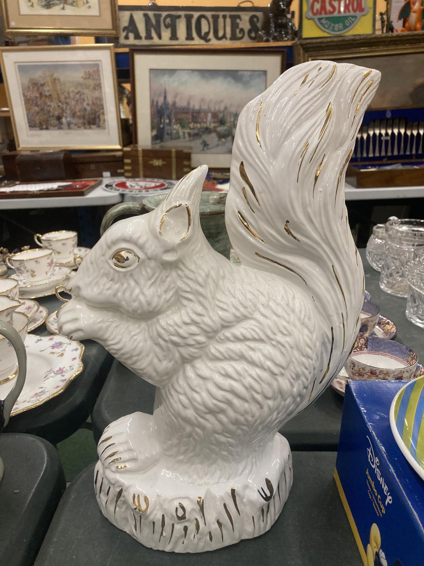 A LARGE WHITE AND GILT SQUIRREL HEIGHT 41CM