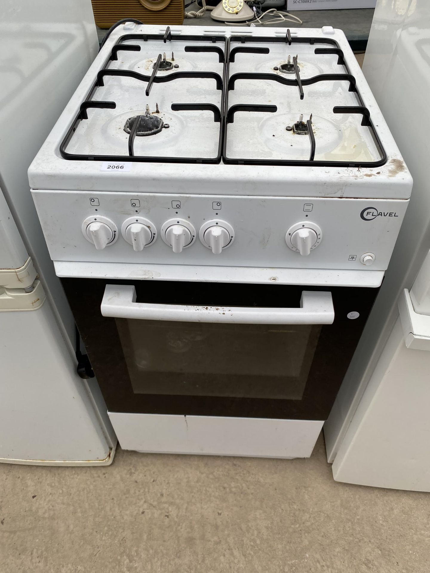 A WHITE FLAVEL ELECTRIC AND GAS FREESTANDING OVEN AND HOB