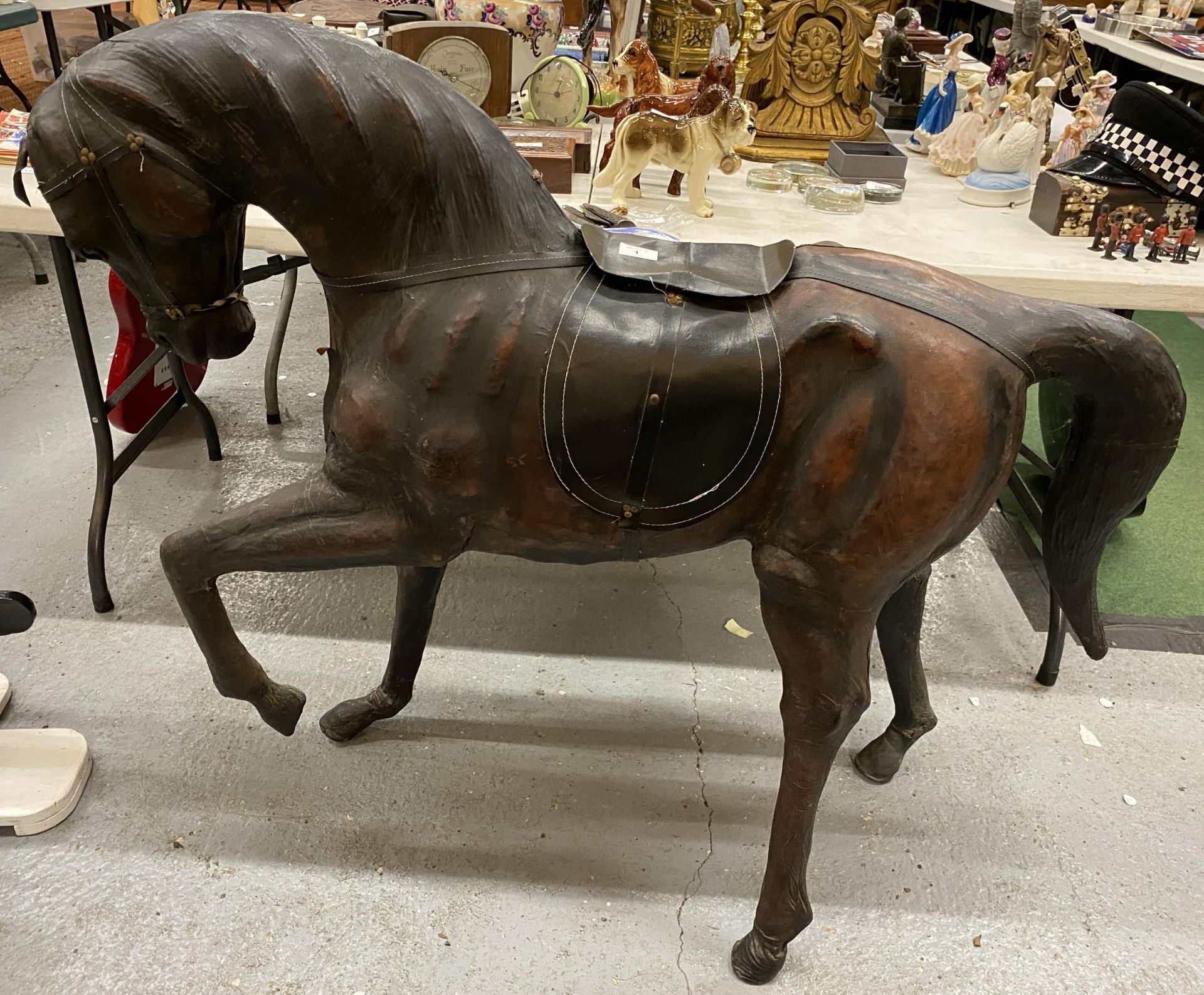 A LARGE VINTAGE LIBERTY STYLE LEATHER COVERED HORSE, HEIGHT 100CM, LENGTH 122CM