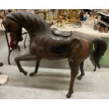 A LARGE VINTAGE LIBERTY STYLE LEATHER COVERED HORSE, HEIGHT 100CM, LENGTH 122CM