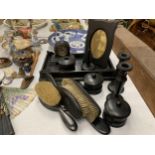 A VINTAGE 'BLACK PRINCE GABOON' EBONY DRESSING TABLE SET TO INCLUDE A TRAY, BRUSHES, HAND MIRROR,