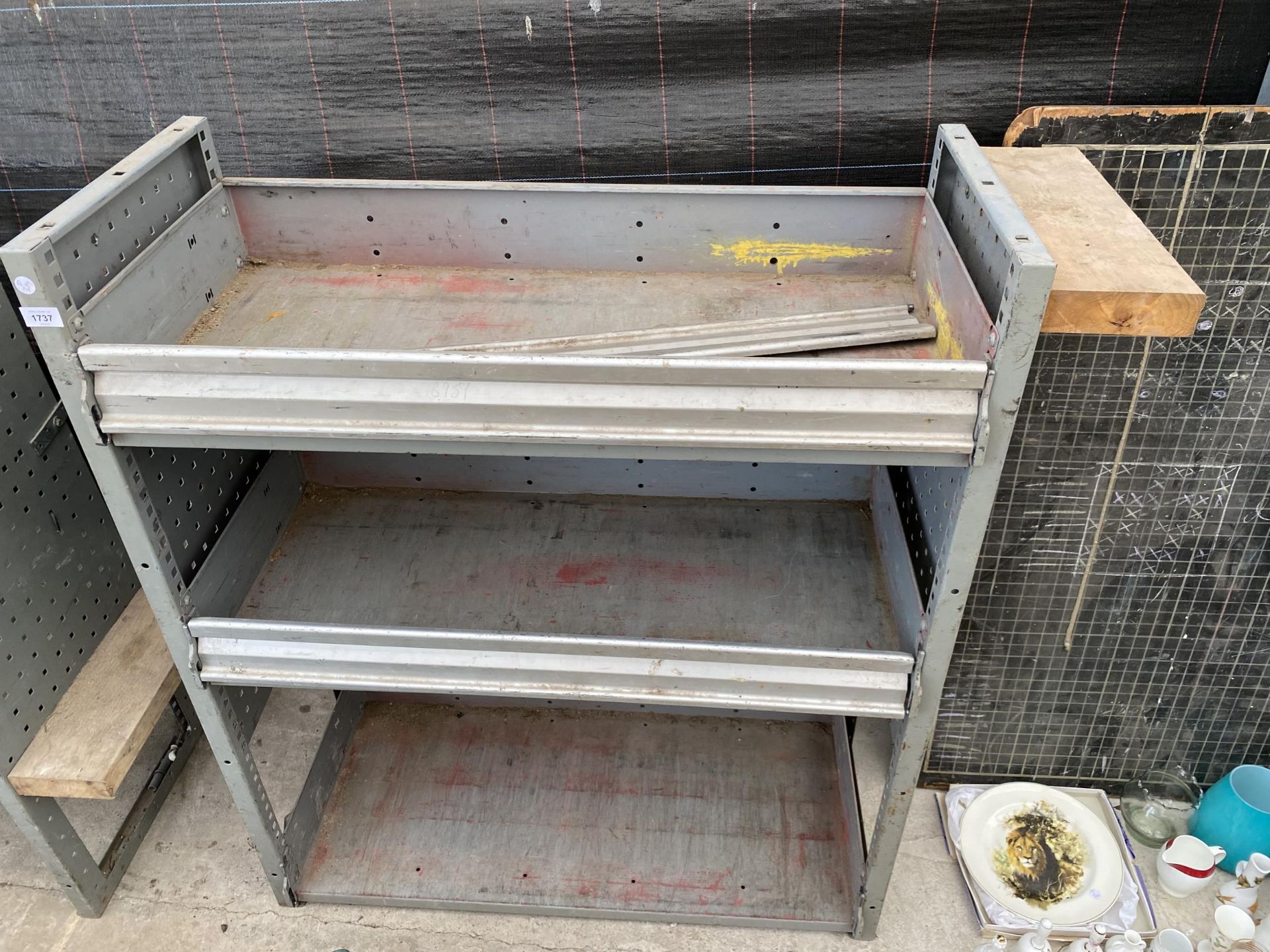 A TWO TIER METAL WORKSHOP SHELVING UNIT