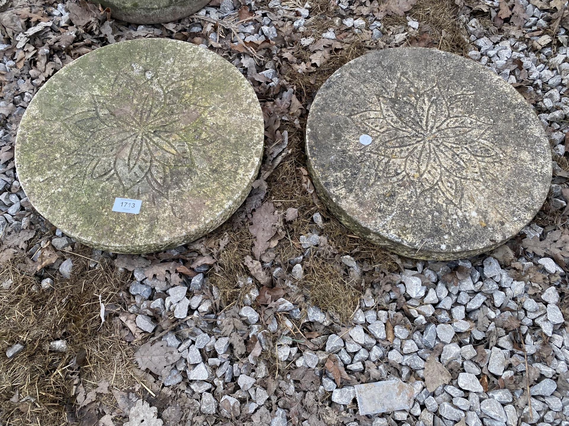 A PAIR OF RECONSTITUTED STONE DISCS