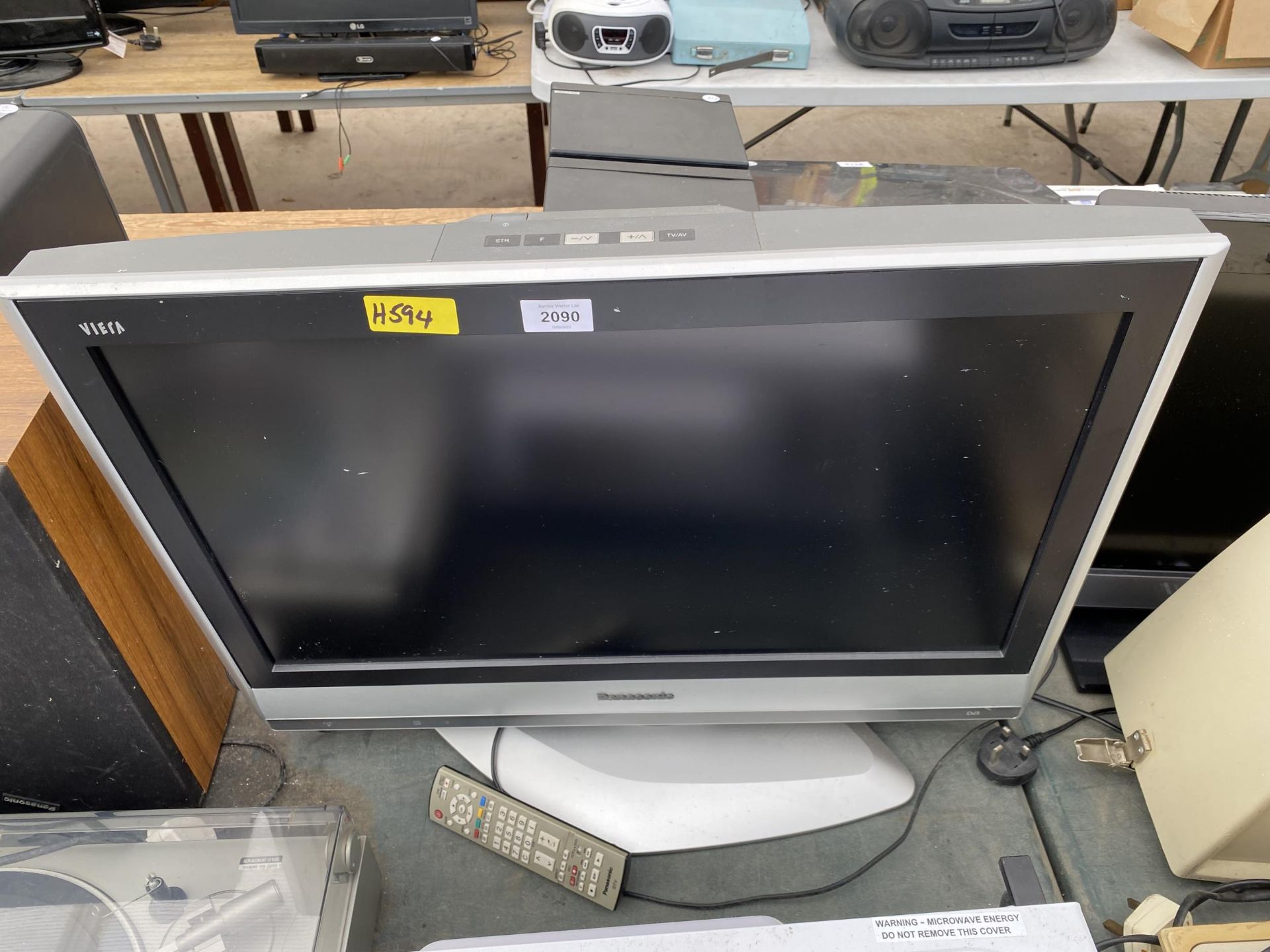 A PANASONIC 26" TELEVISION WITH REMOTE CONTROL