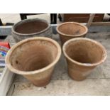 FOUR LARGE TERACOTTA POTS