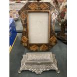 AN ORNATE PHOTO FRAME AND A SILVER PLATED STAMP HOLDER