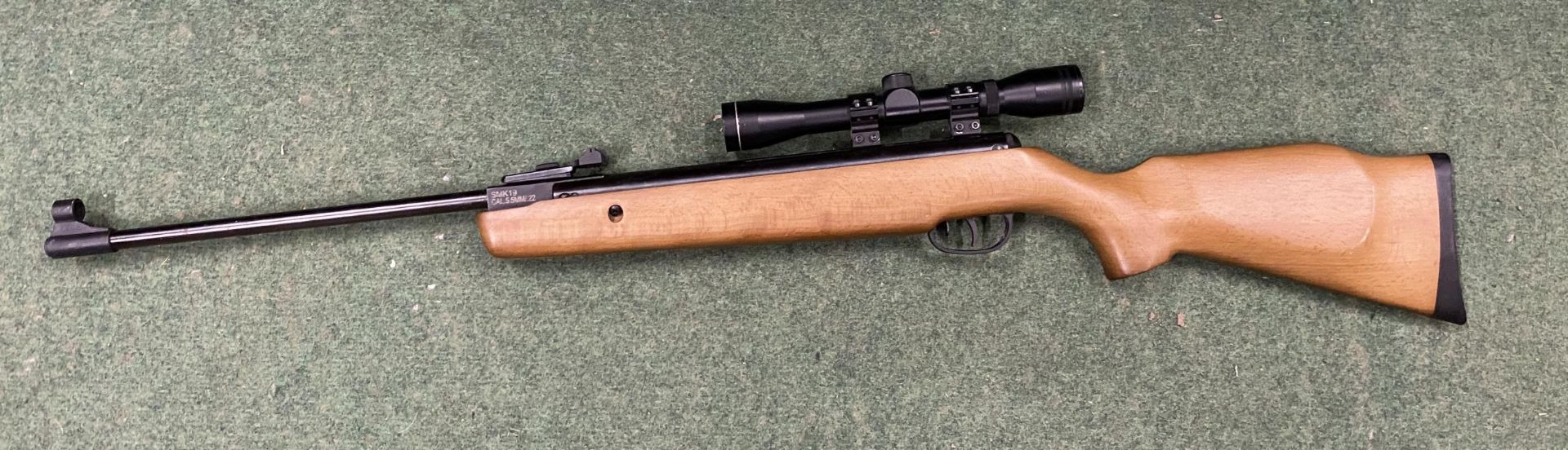 A SMK19 .22 AIR RIFLE WITH SMK 4X32 SCOPE