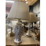 TWO CERAMIC BLUE AND WHITE FLORAL LAMPS WITH CREAM AND BLUE AND WHITE TRIM SHADES
