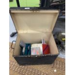 A VINTAGE METAL BOX CONTAINING ASSORTED CARD GAMES AND BOOKS