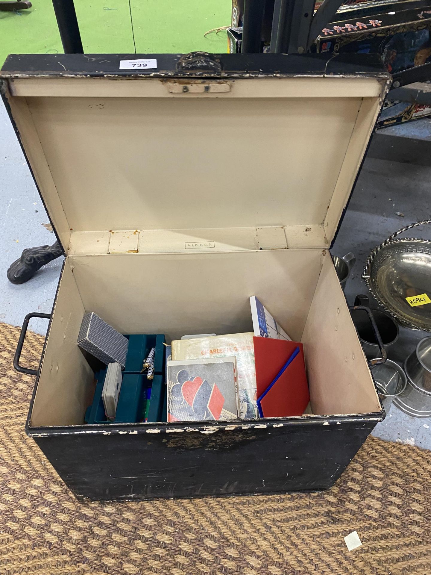 A VINTAGE METAL BOX CONTAINING ASSORTED CARD GAMES AND BOOKS