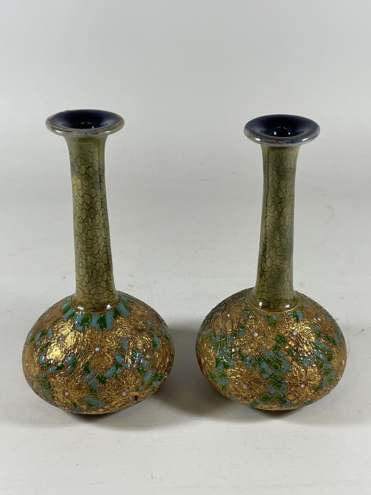 A PAIR OF ROYAL DOULTON LAMBETH ART NOUVEAU BOTTLE VASES