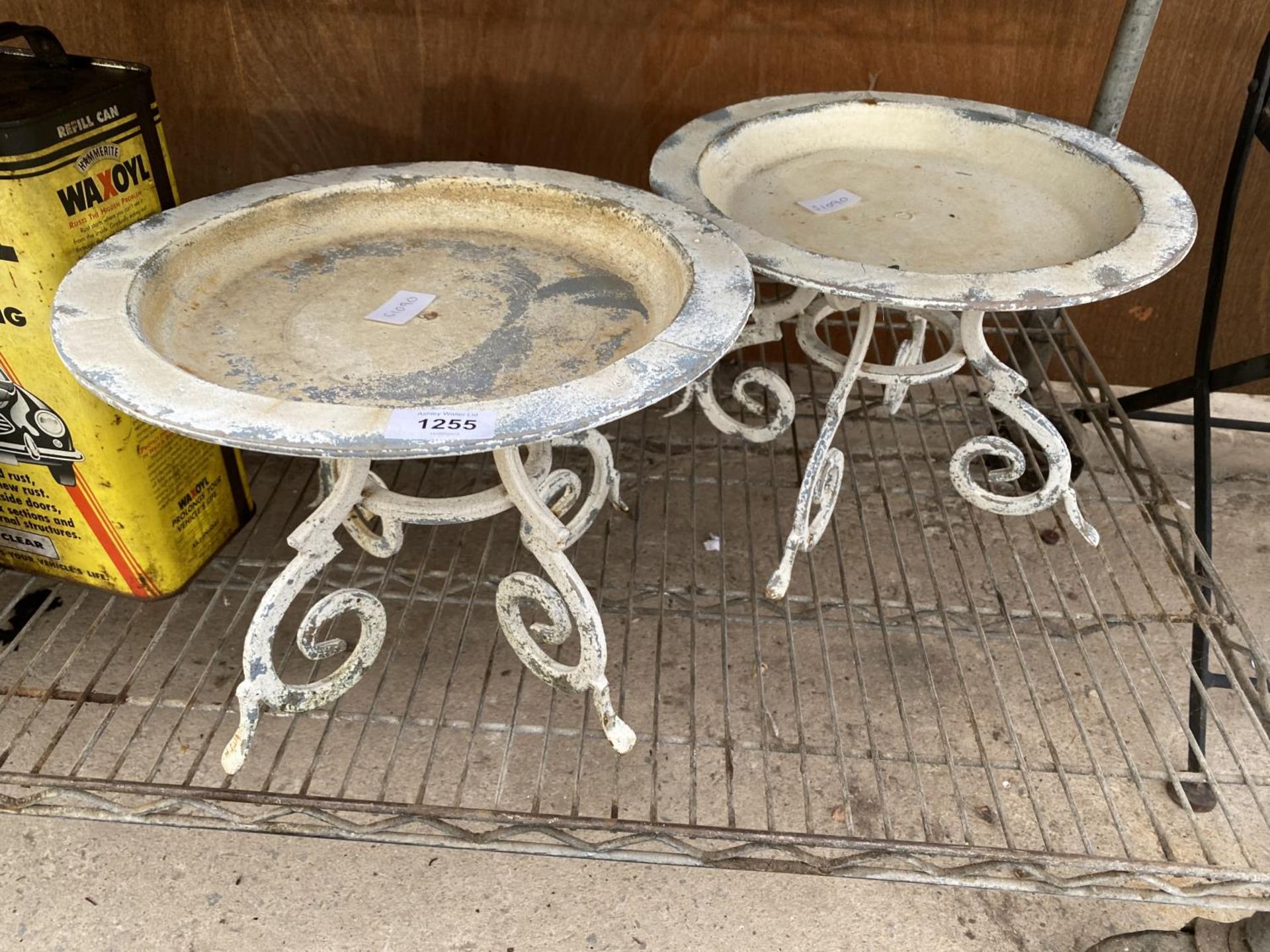 A PAIR OF ROUND METAL TRIPOD PLANT STANDS
