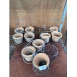 THREE VINTAGE FOUR SECTION CARRYING RACKS AND TEN TERRACOTTA POTS