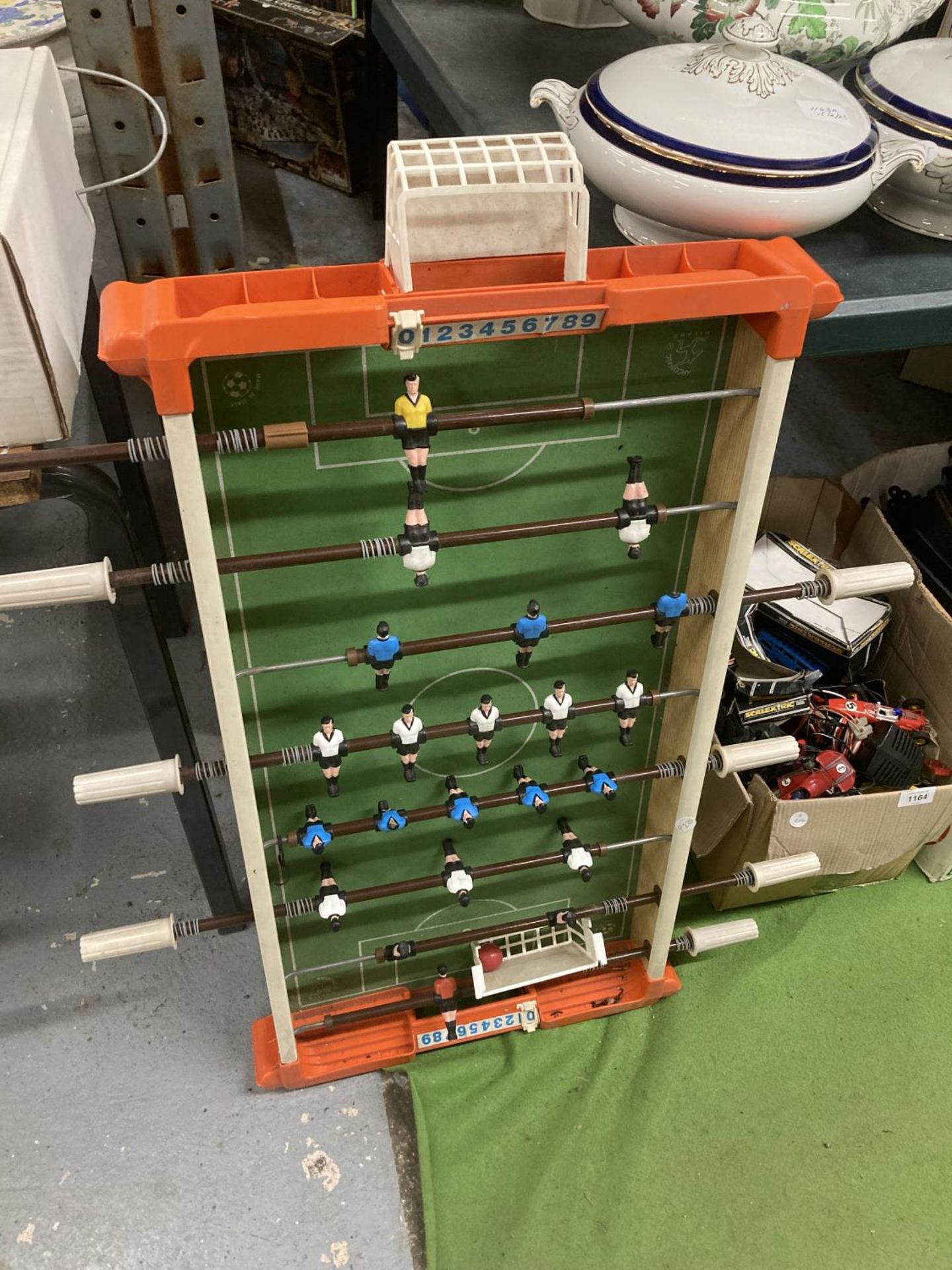A VINTAGE TABLE SOCCER GAME - ONE PLAYER HAS LOST HIS HEAD, WIDTH 45CM, LENGTH APPROX 89CM