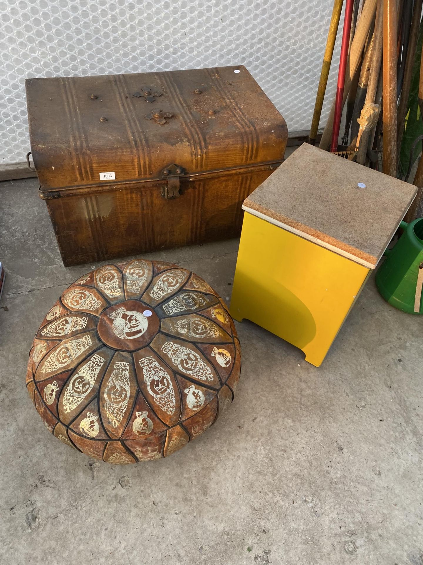 A VINTAGE METAL TRAVEL TRUNK TO INCLUDE TOOLS AND A TRIBAL STYLE CUSHION