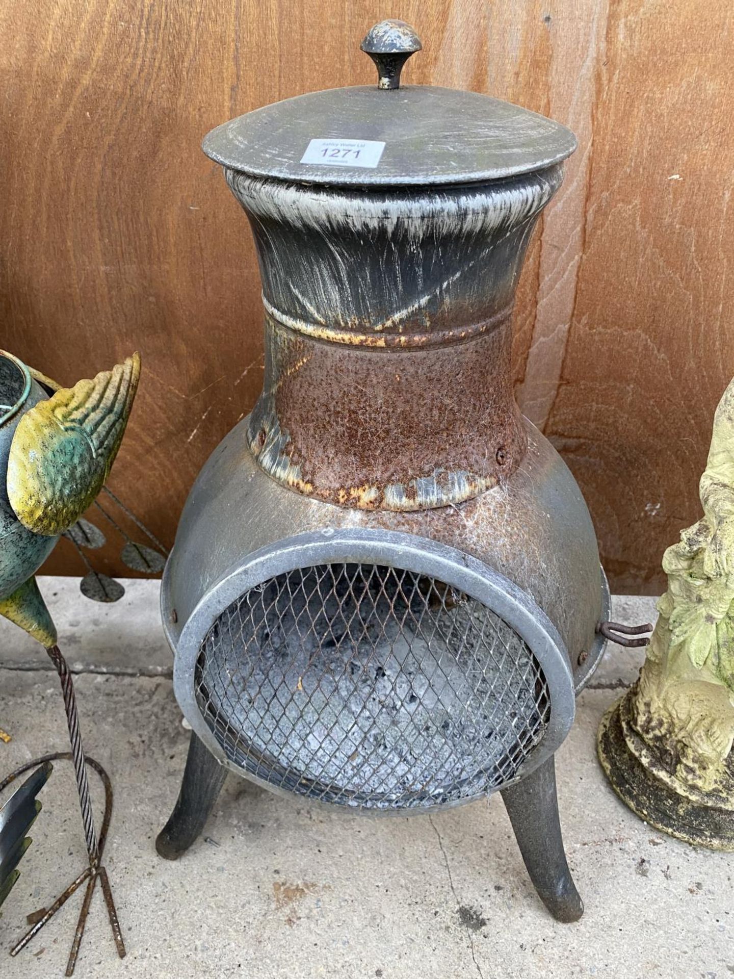 A METAL GARDEN CHIMENEA