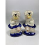 TWO PAIRS OF STAFFORDSHIRE POTTERY SPANIELS