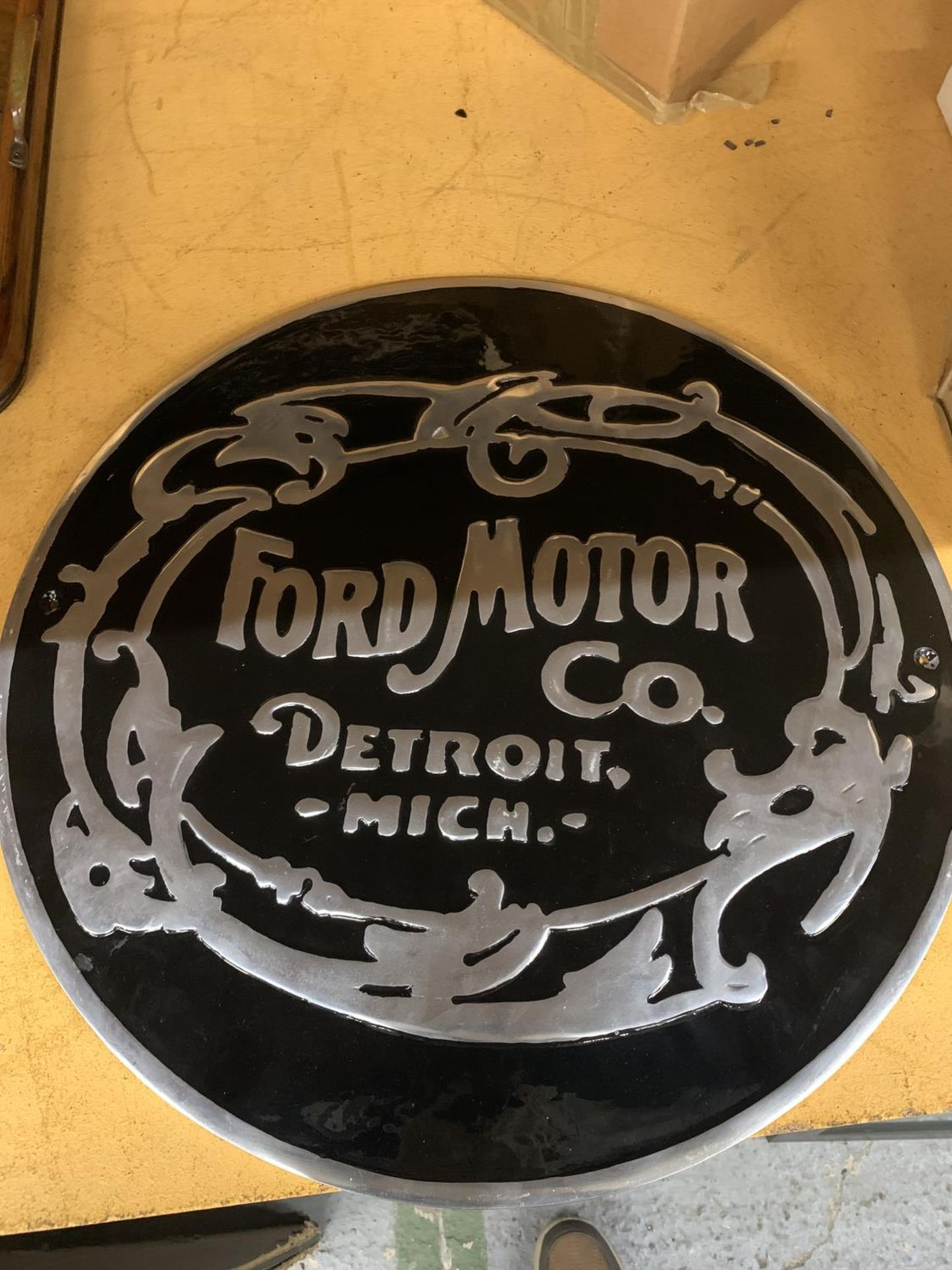 A CHROME AND BLACK FORD MOTOR CO. DETROIT SIGN DIAMETER 49.5CM