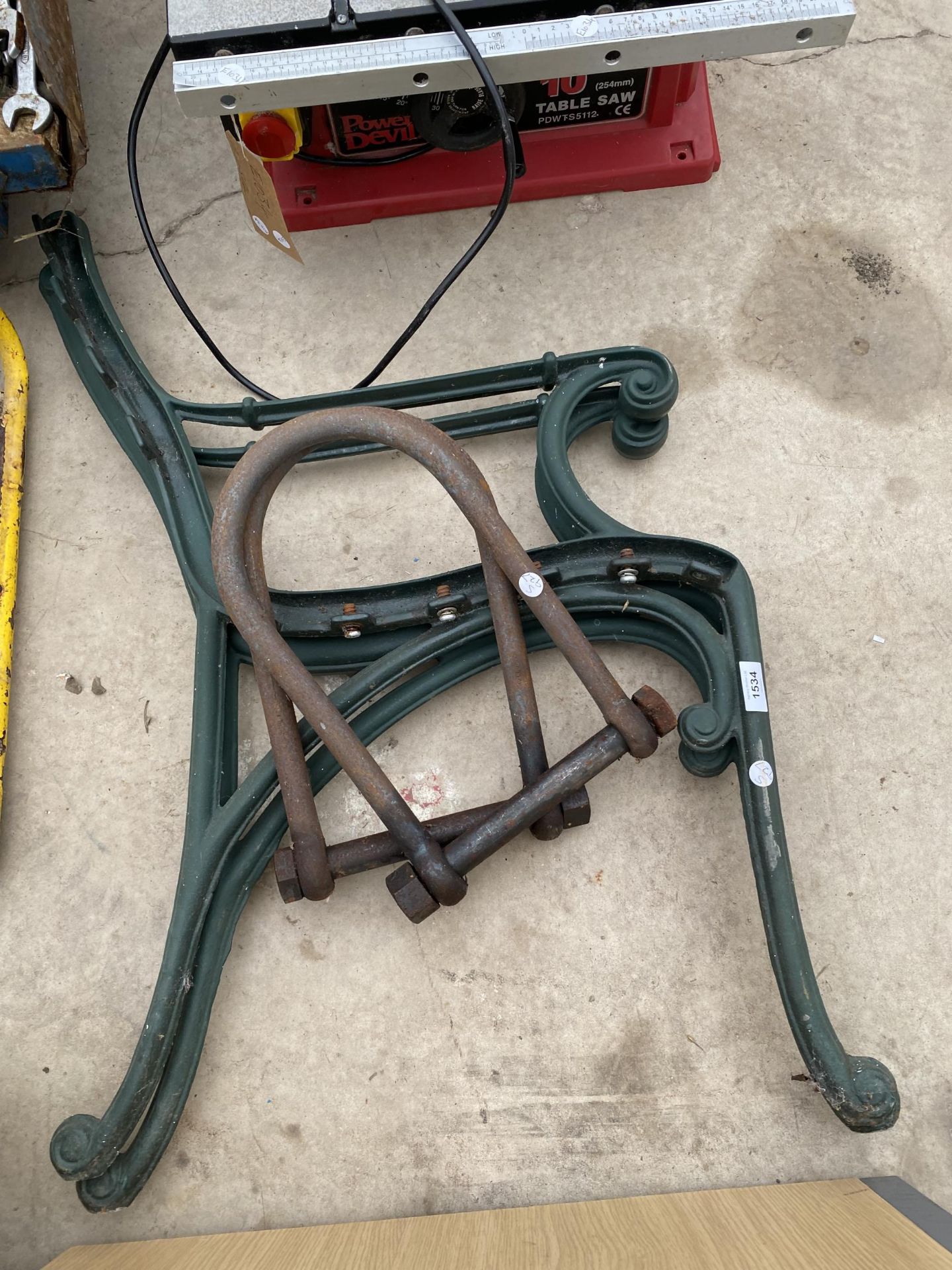 A PAIR OF CAST BENCH ENDS AND TWO LARGE D LINKS