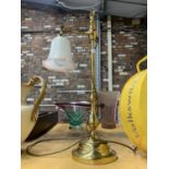 A VINTAGE STYLE BRASS TABLE LAMP WITH A FLUTED PALE PINK GLASS SHADE