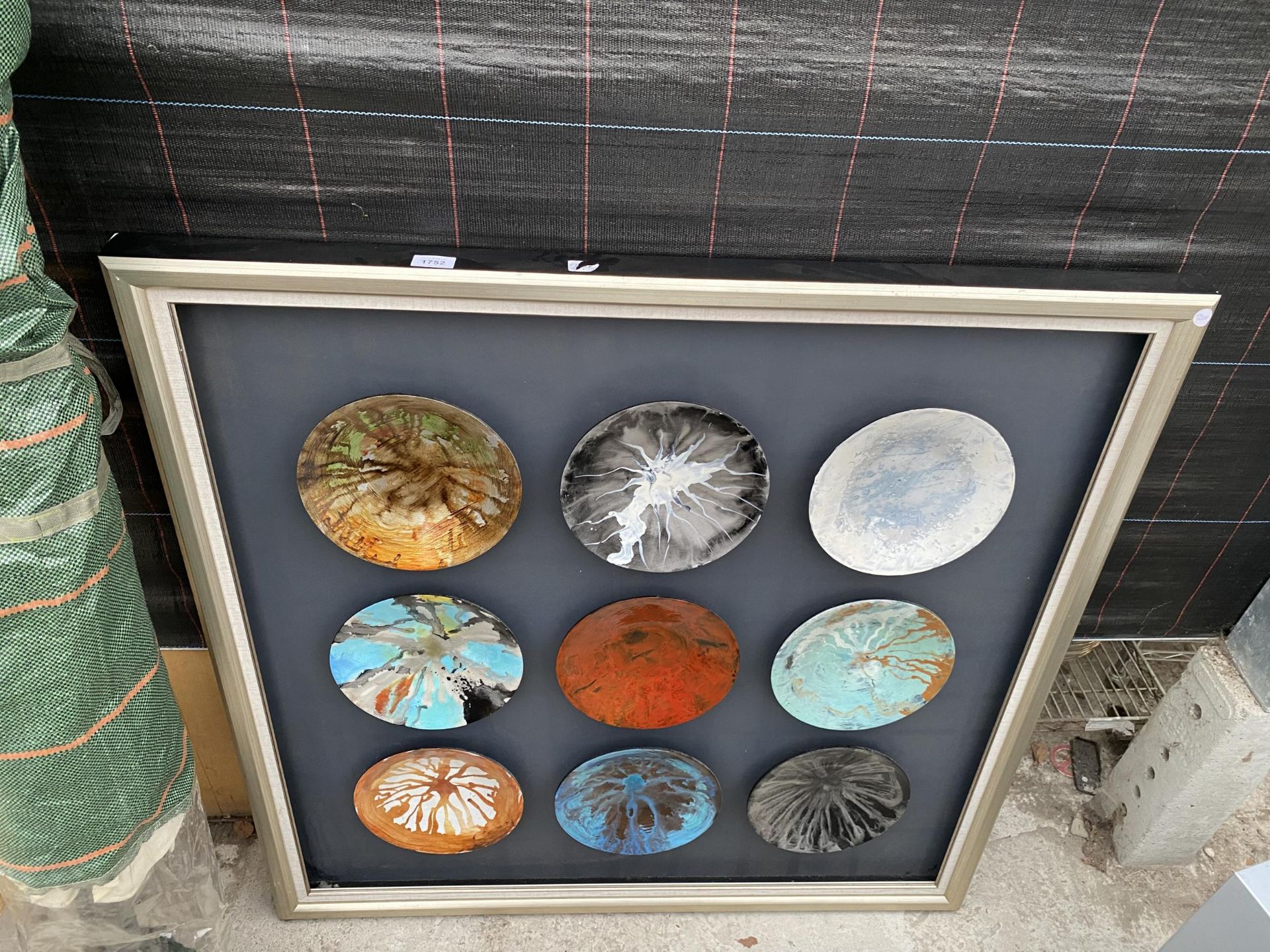 NINE ORNAMENTAL PLATES MOUNTED IN FRAME 42" SQUARE