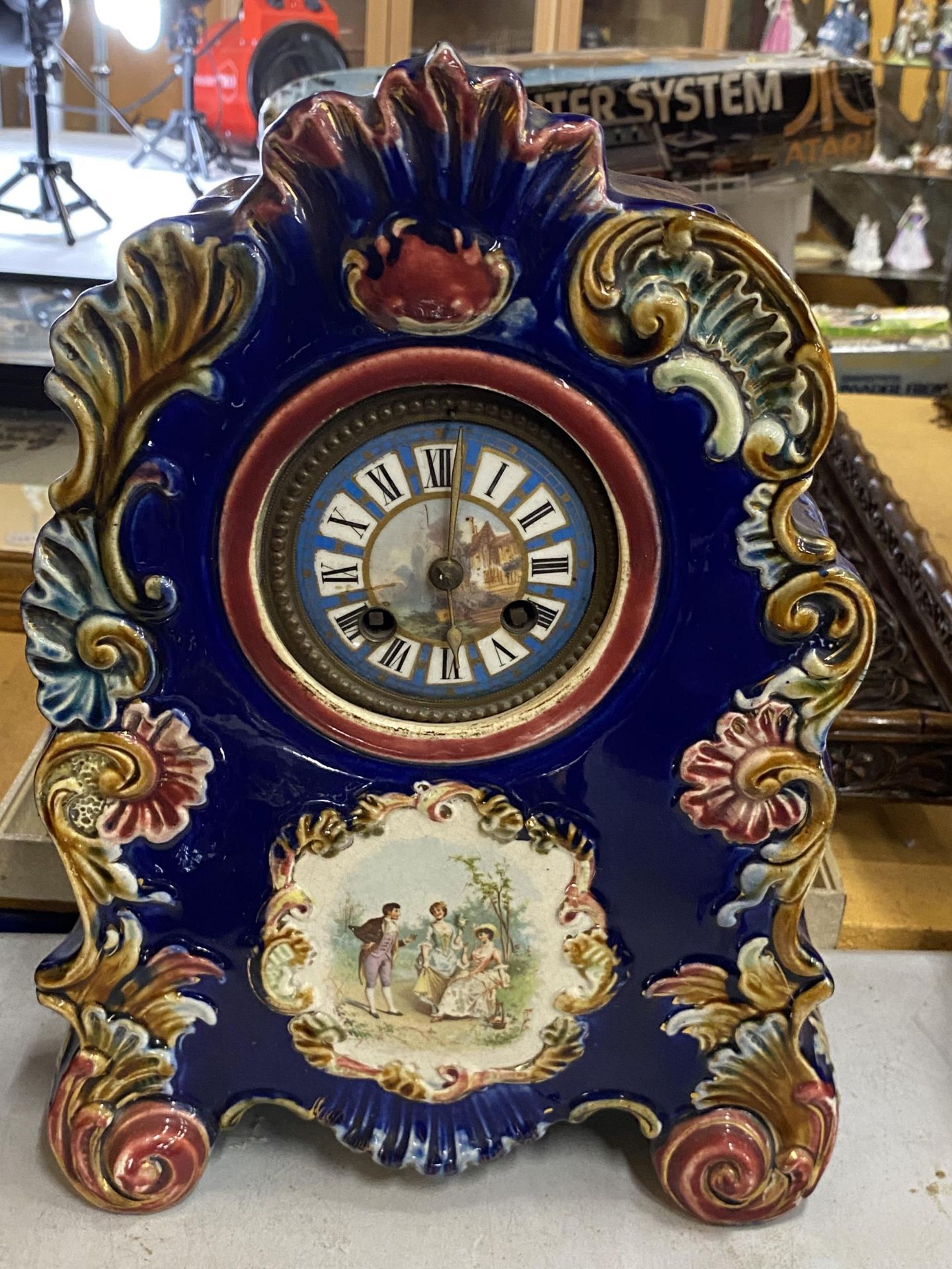 A VINTAGE CONTINENTAL POTTERY CLOCK WITH HAND PAINTED DIAL, HEIGHT 33CM