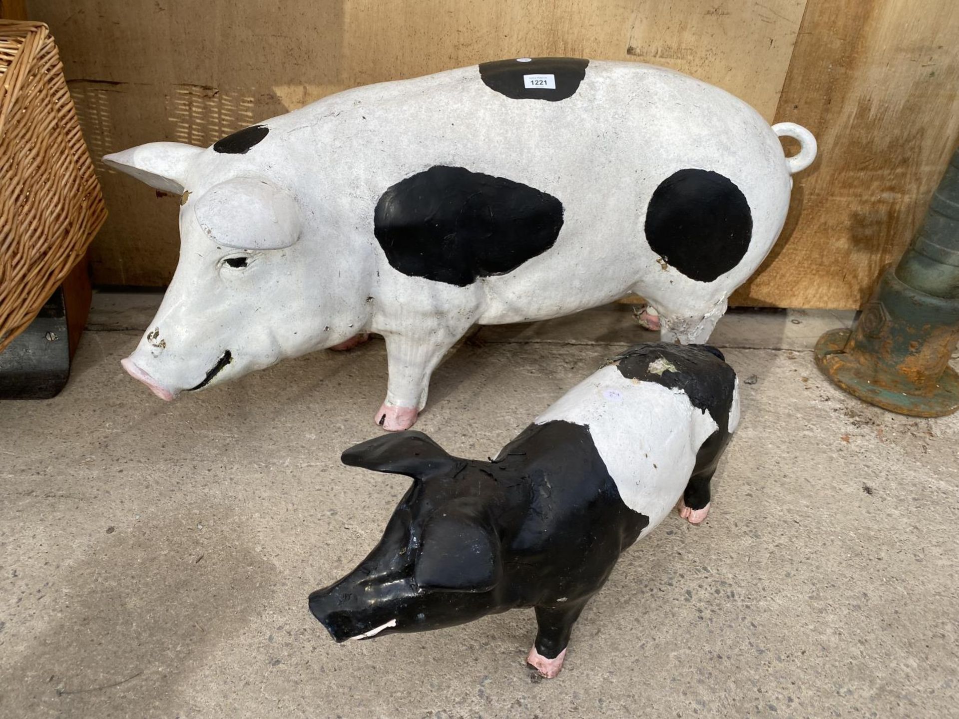 A LARGE FIBRE GLASS PIG FIGURE AND A FURTHER SMALL FIBRE GLASS PIG