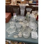 A LARGE ASSORTMENT OF GLASS WARE TO INCLUDE VASES, DECANTORS AND A JELLY MOULD ETC