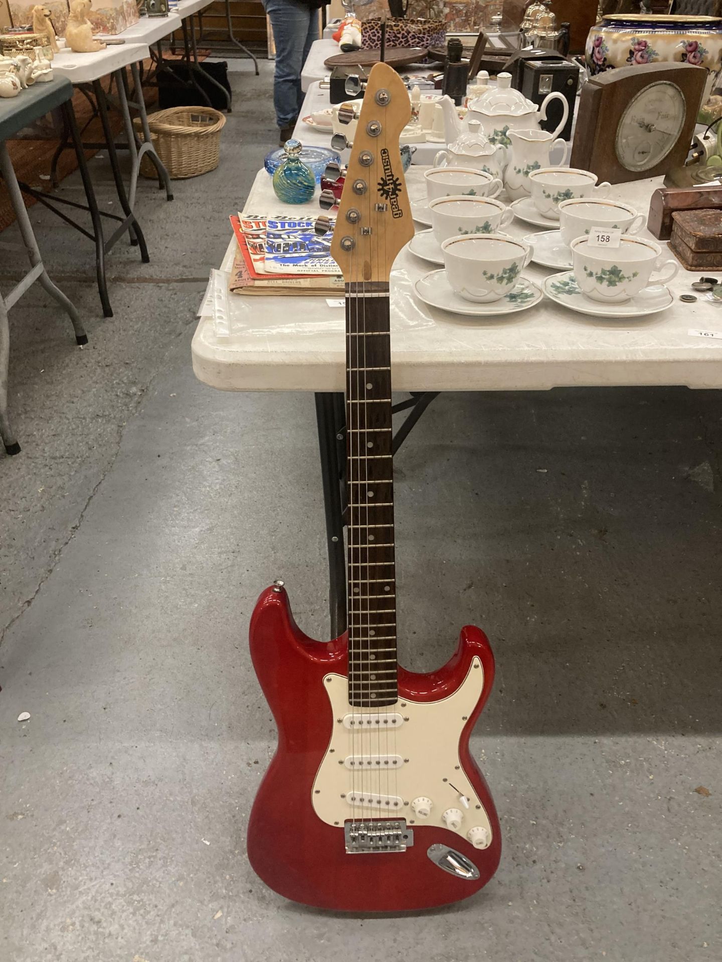 A 'GEAR4MUSIC' RED ELECTRIC GUITAR