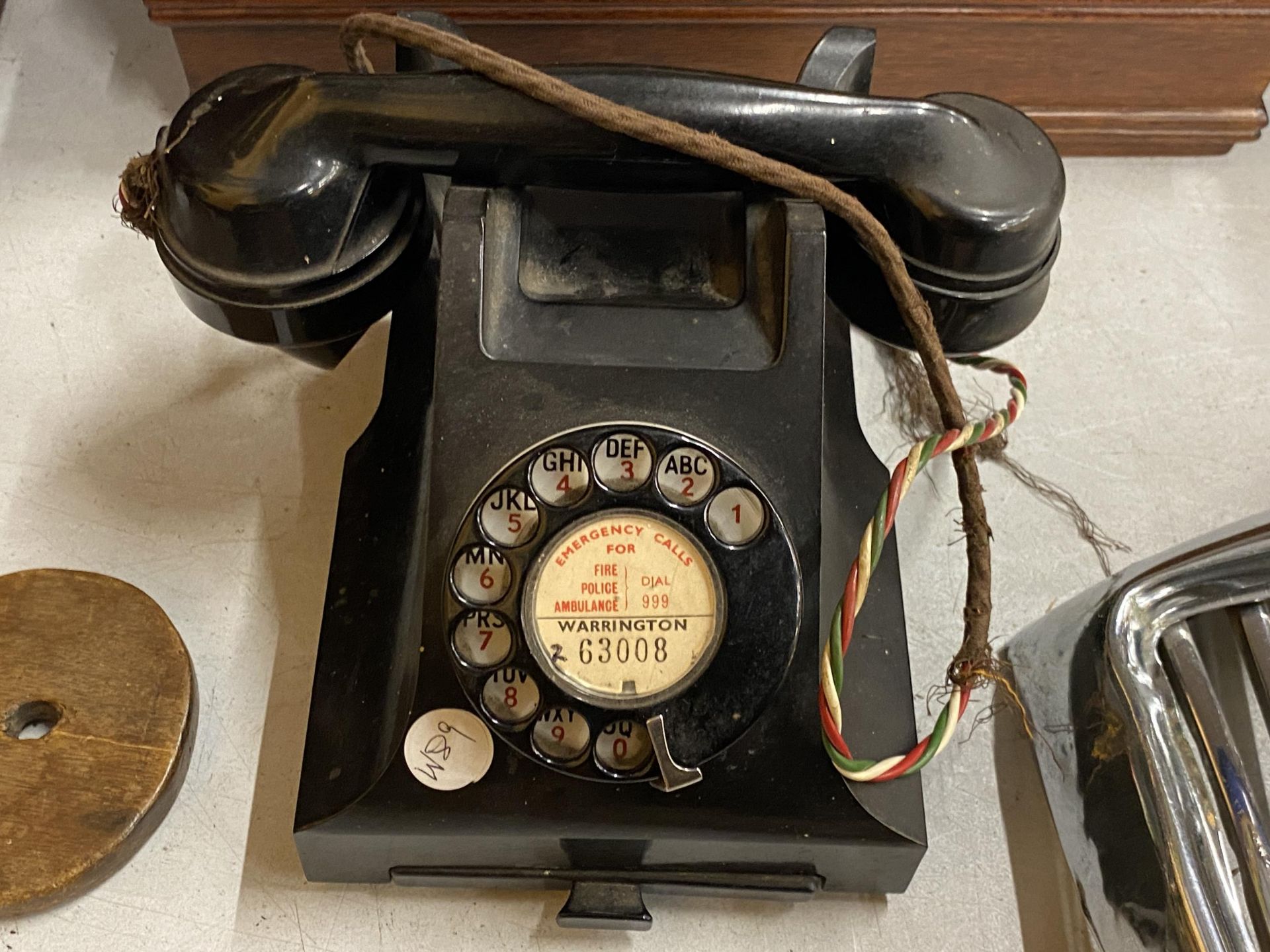 A VINTAGE BLACK BAKELITE TELEPHONE