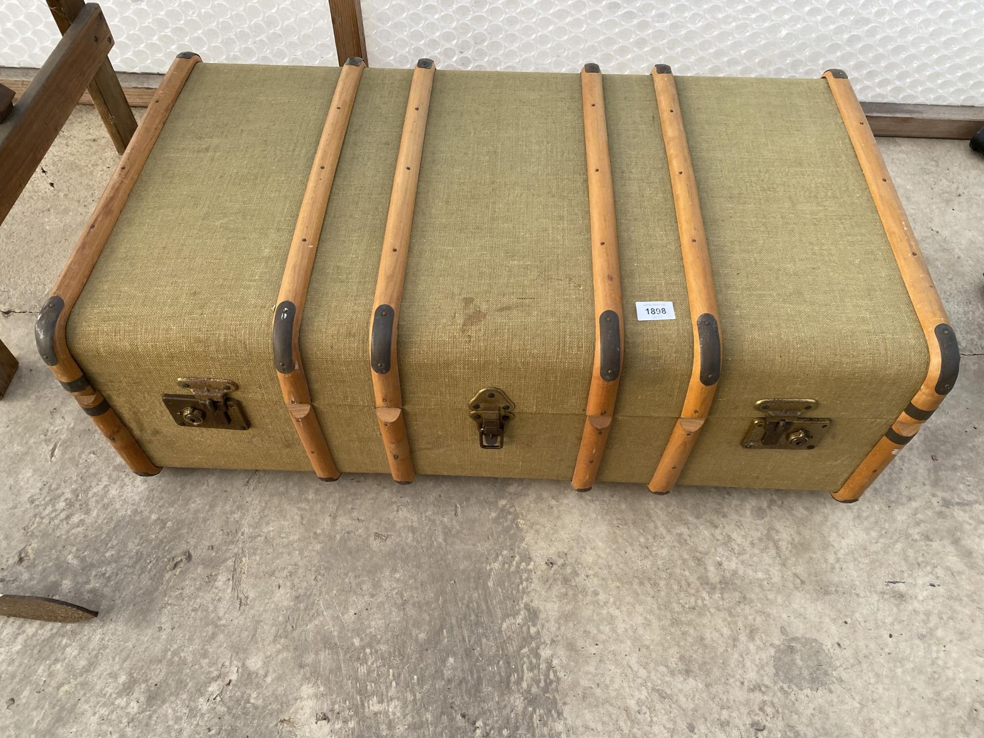 A VINTAGE WOODEN BANDED TRAVEL CASE