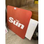 A METAL SUN NEWSPAPER SIGN