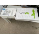 A NINTENDO WII AND A WII FIT BOARD