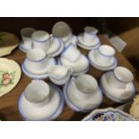 A QUANTITY OF CHINA CUPS, SAUCERS, SIDE PLATES, A SUGAR BOWL AND CREAM JUG