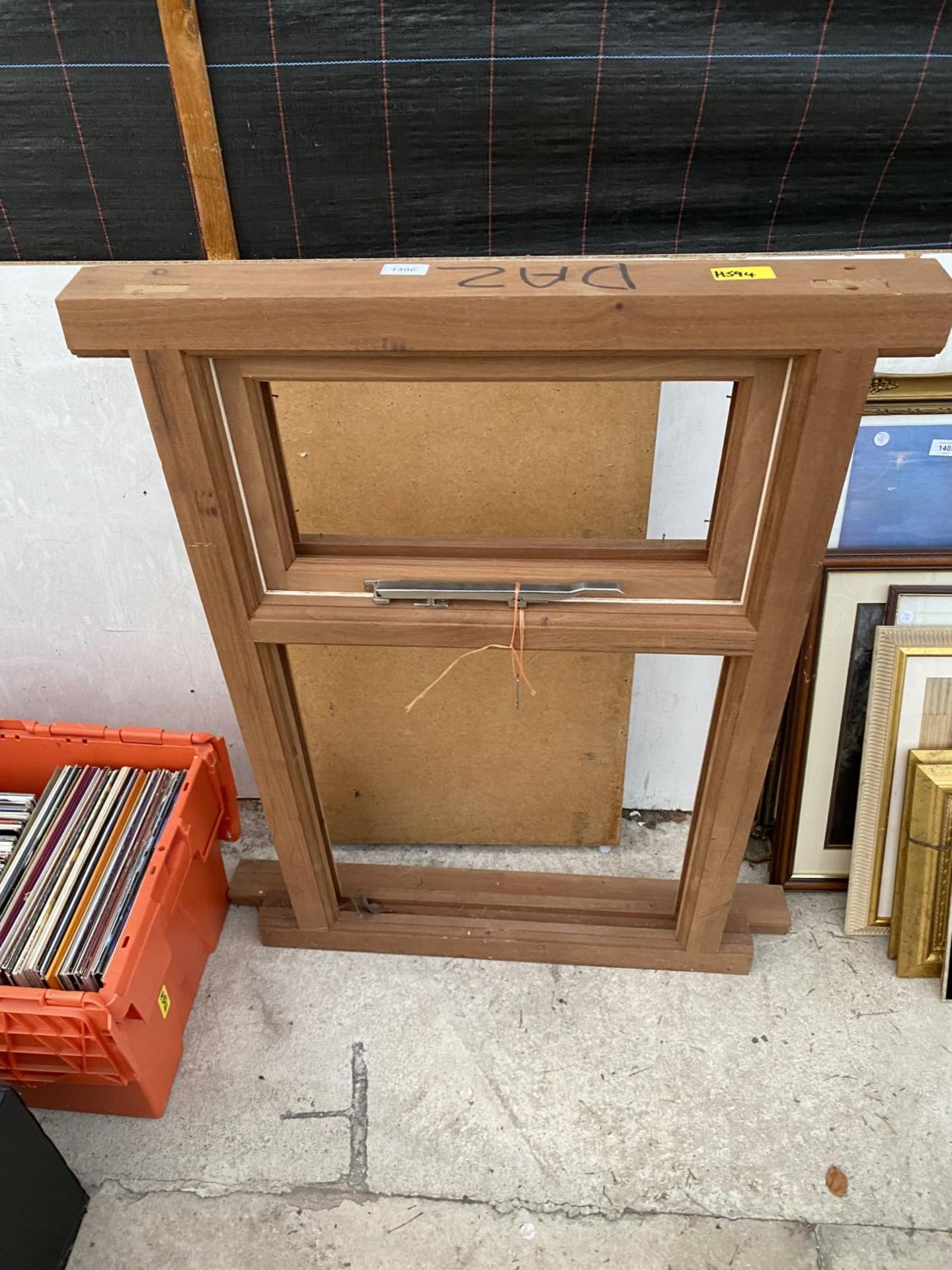 A FOLDING PASTING TABLE AND A WOODEN WINDOW FRAME