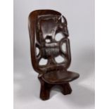 A VINTAGE TRIBAL WOODEN MODEL OF A BIRTHING CHAIR, HEIGHT 16CM