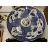 AN ORIENTAL BLUE AND WHITE CHARGER - A/F DIAMETER 36CM