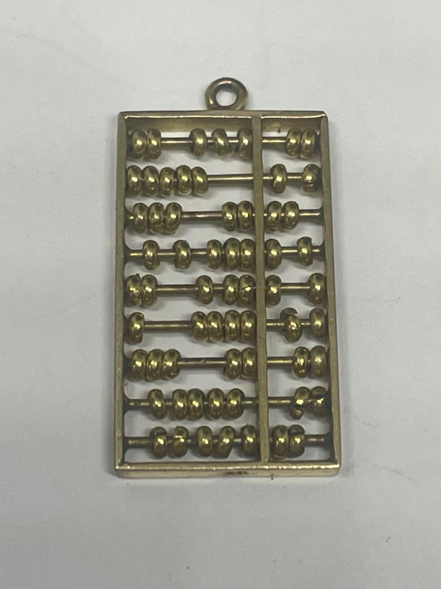 AN 9 CARAT GOLD ABACUS PENDANT GROSS WEIGHT 3.17 GRAMS